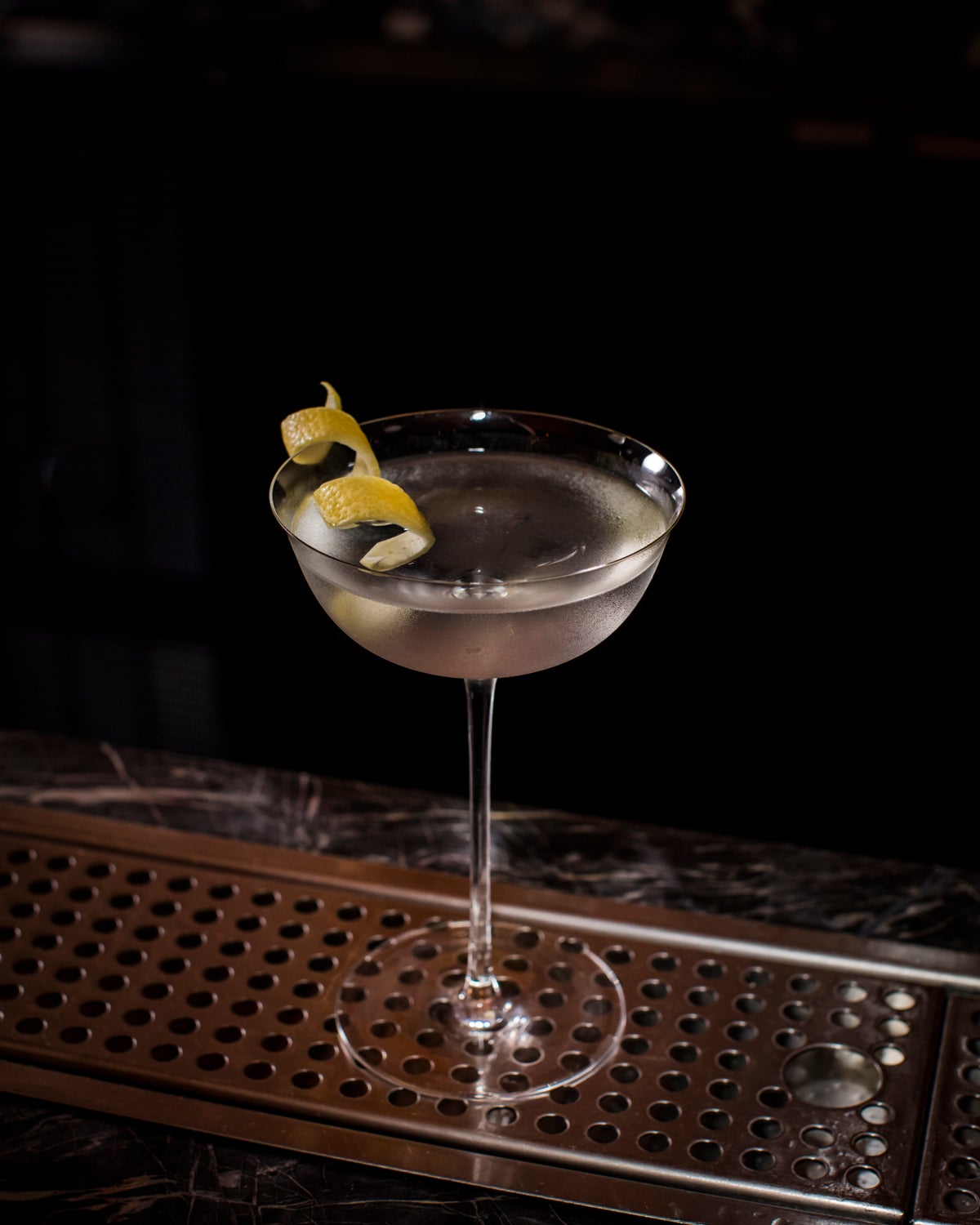 Vesper Martini in martini glass with lemon twist.