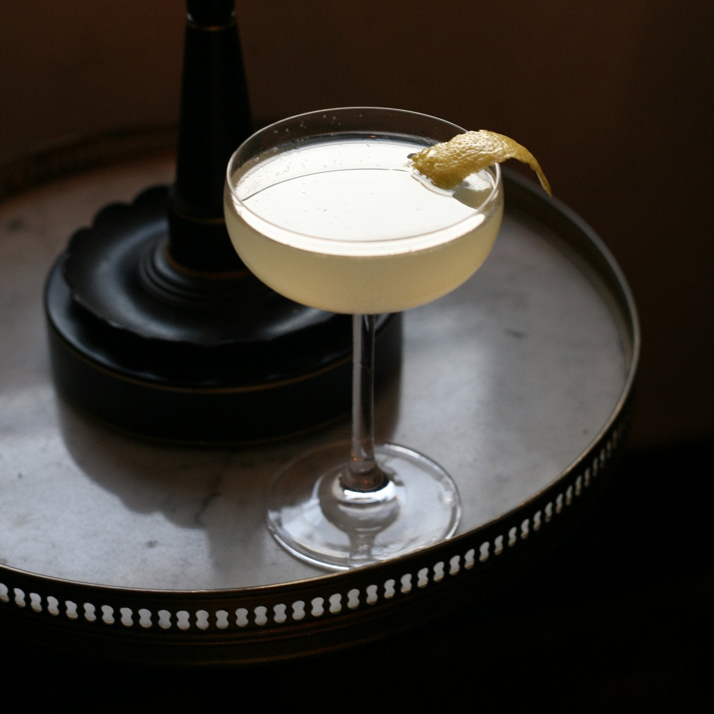 Twentieth Century cocktail with lemon twist.