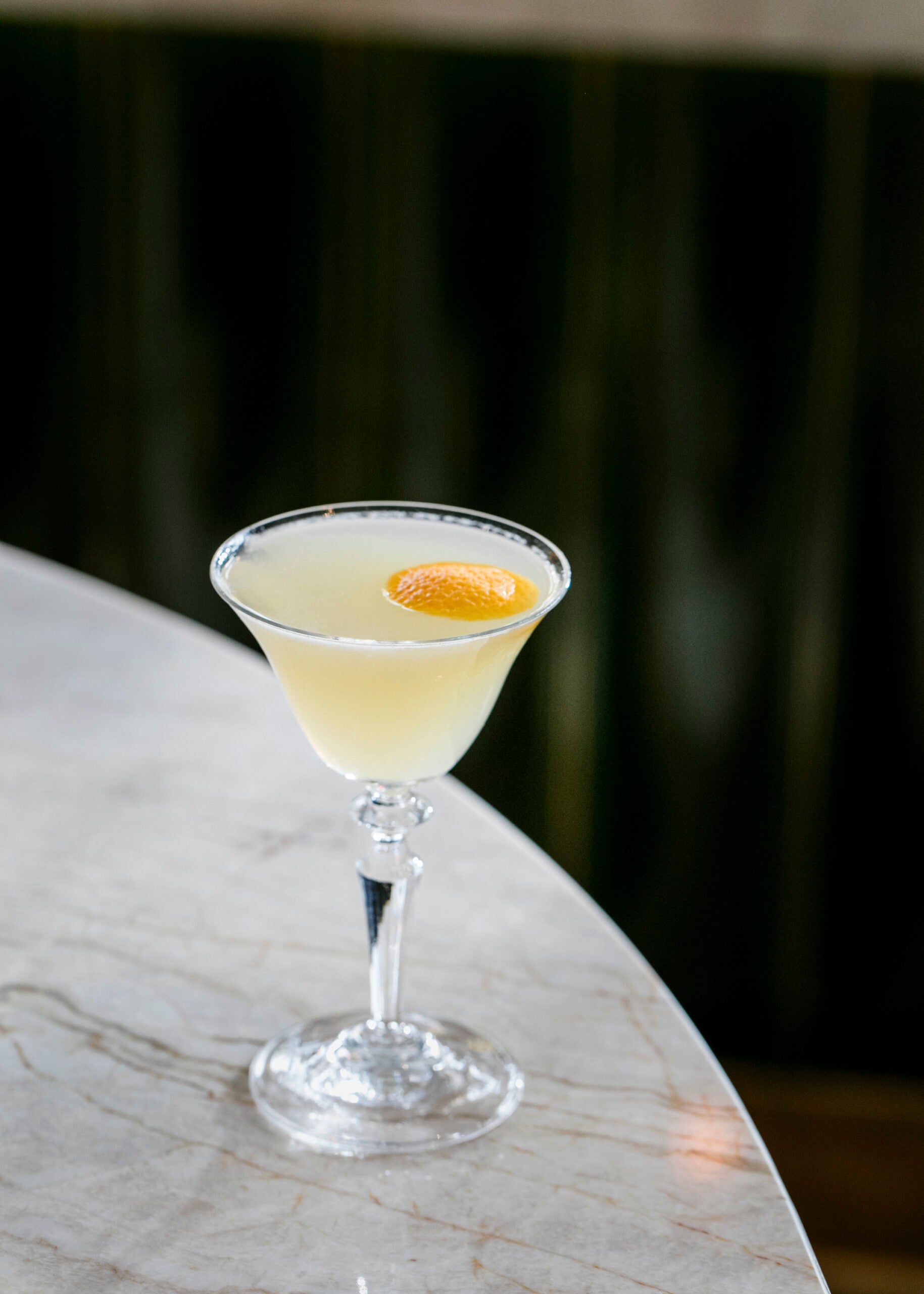 Corpse Reviver cocktail with lemon slice.